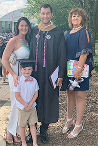 Michael Logan with family at graduation