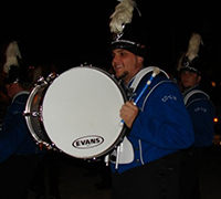 Jonathan Giangrosso carrying a bass drum