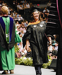 Celeste Kallenborn walking at graduation