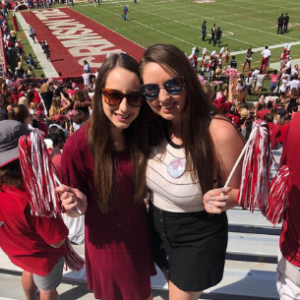 Becca with a friend at a football game