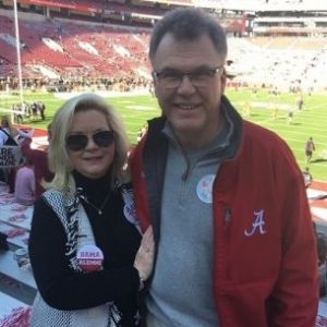 Ron and his wife at an Alabama football game