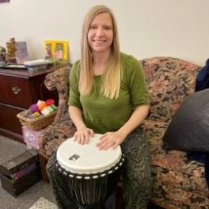 Jessica with a drum from drum therapy