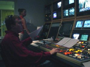 Michael directing a newscast from the newsroom
