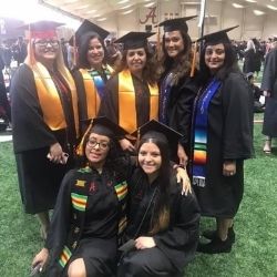 Sonia with a group of graduates from her cohort at graduation