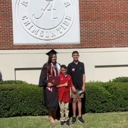 Crystal and her sons at graduation