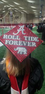 Tina's mortar board that reads, "ROLL TIDE FOREVER"